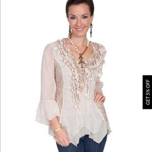 The perfect top for dress up or down.