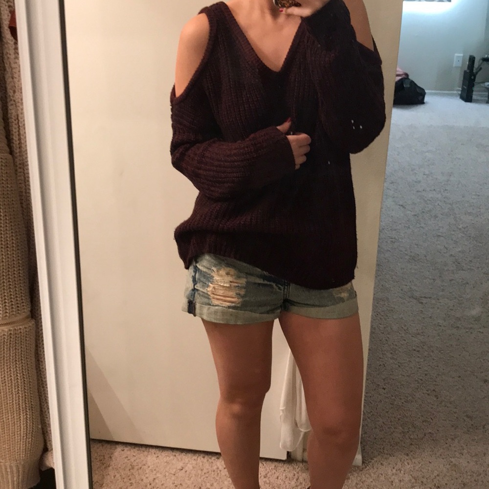 Peep shoulder, deep red chunky sweater.