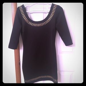 Black fitted dress with gold accent