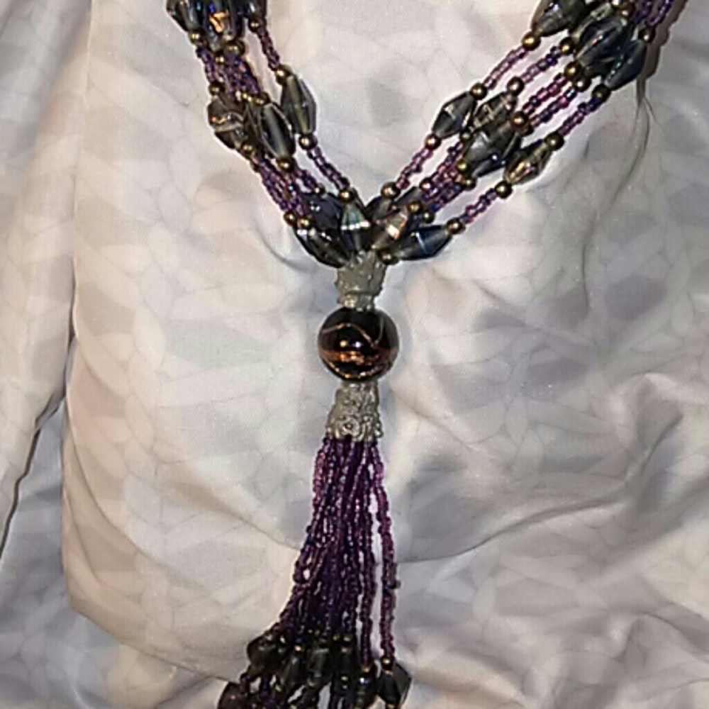 A beautiful purple and silver beaded necklace
