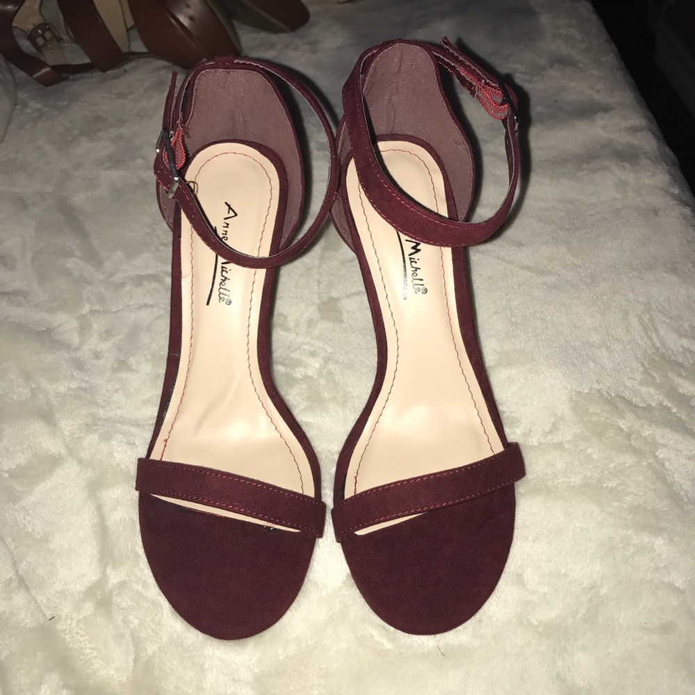 Burgundy strappy heels.