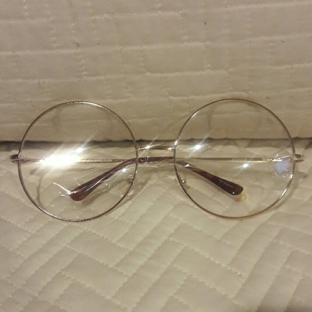 Sphere Fashion  frames clear in gold
