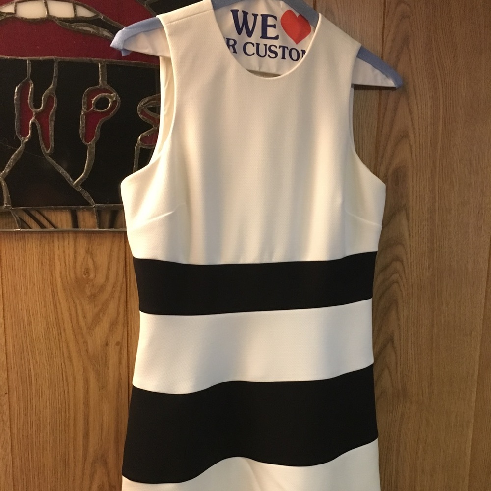Black and white woman's sleeveless dress