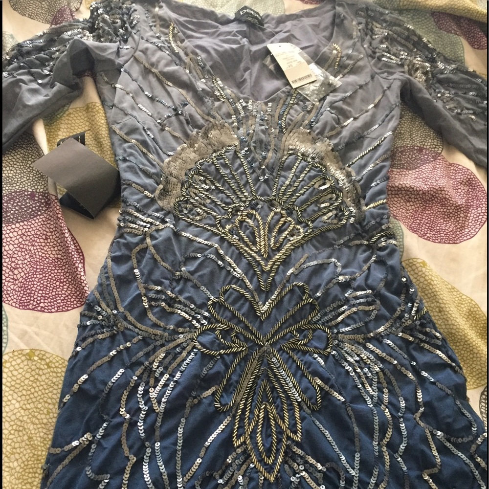 Brand new Bebe dress with tags on it . Never worn