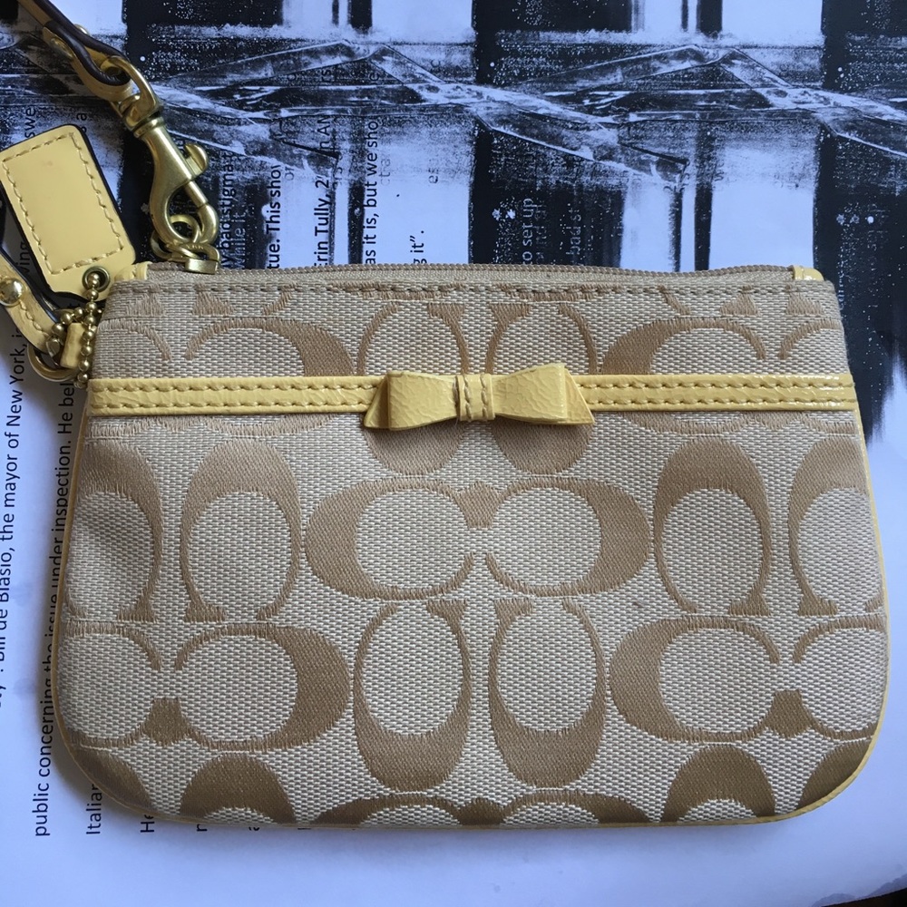 Coach wristlet-pale yellow