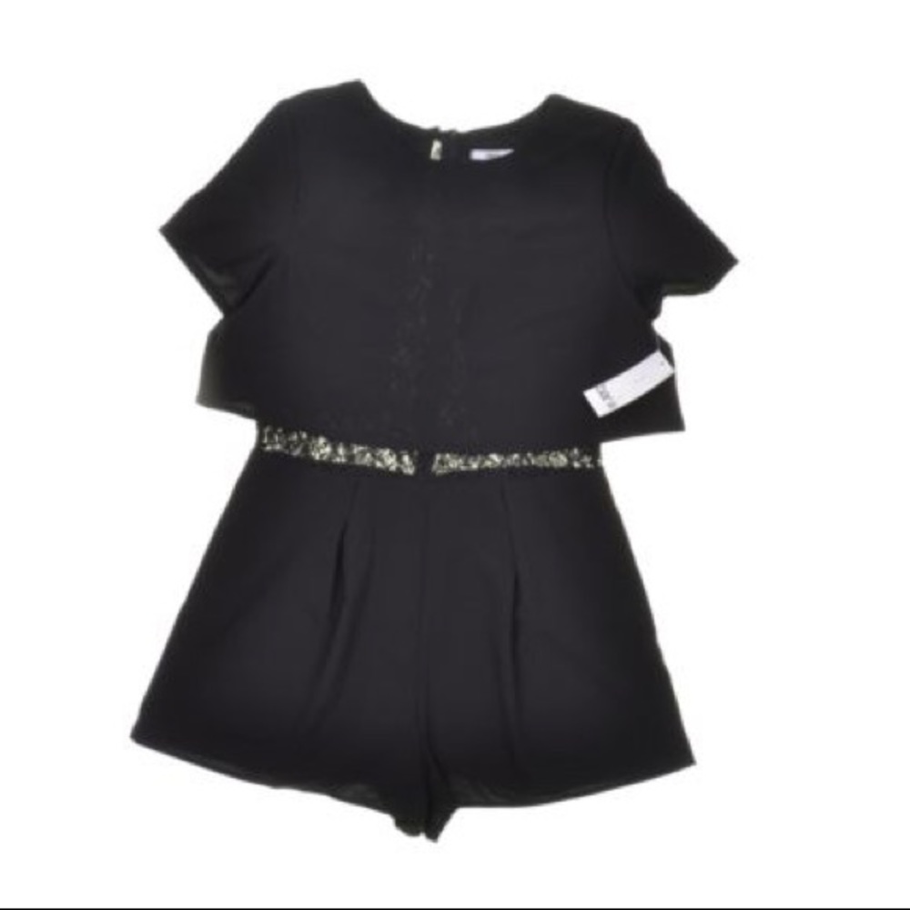 Black split-back romper with lace detail.