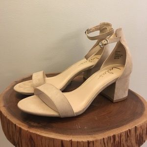 Heels. Brand new, never worn. Run true to size.