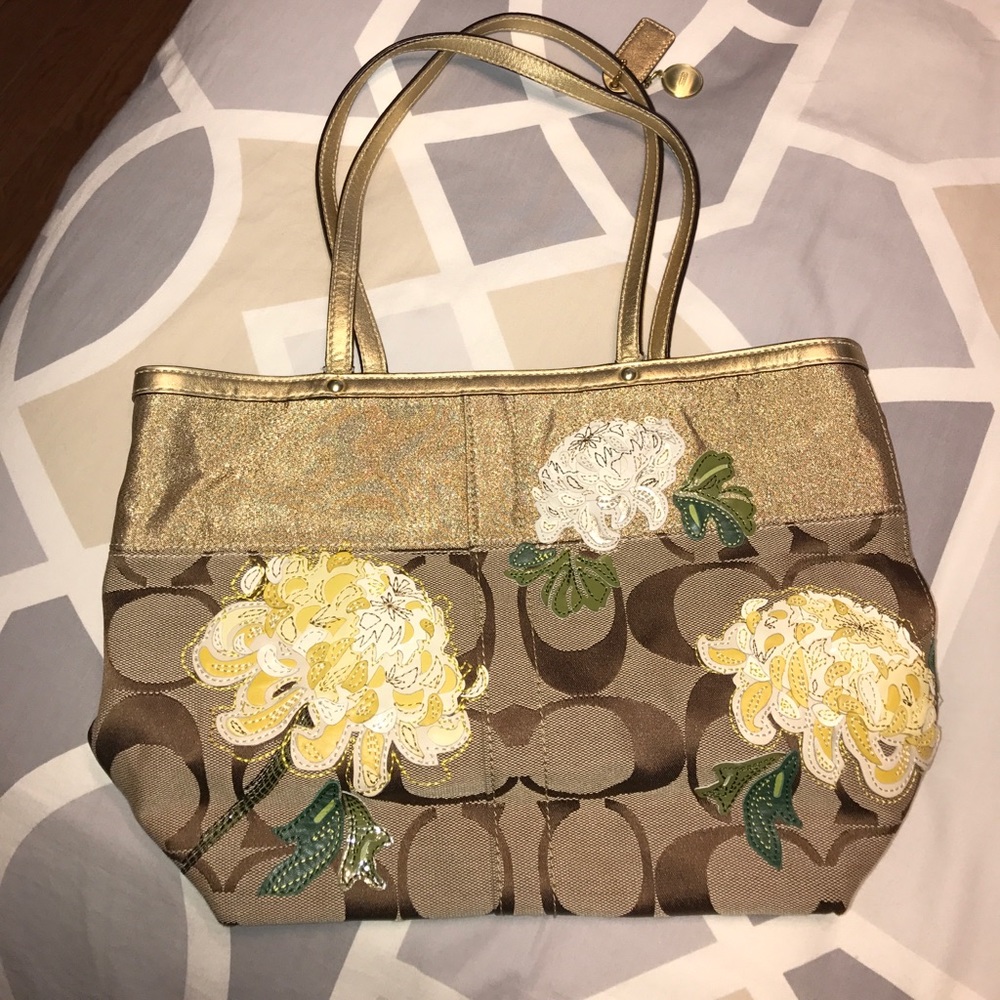 Official coach gold purse with flower patch