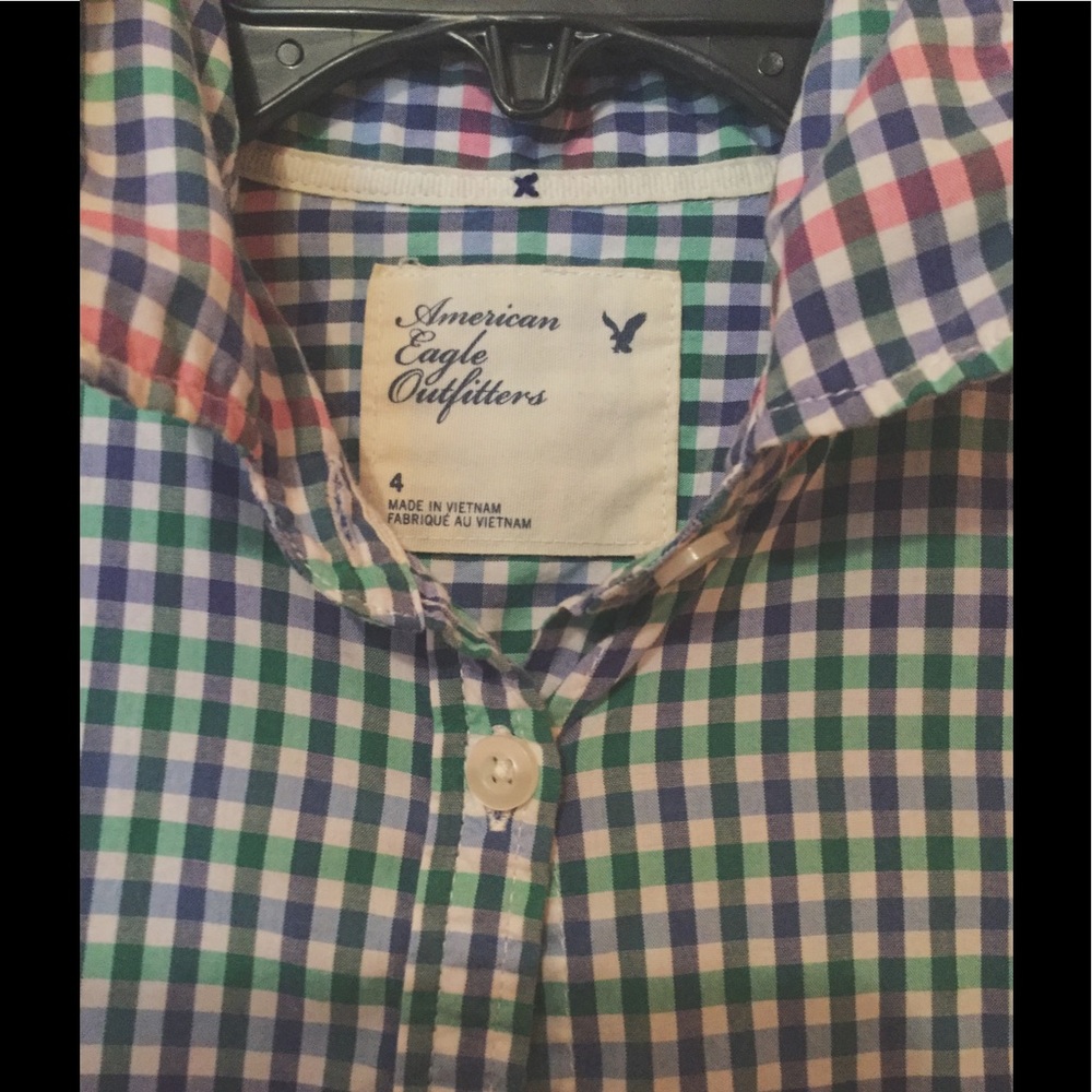Plaid button down shirt.