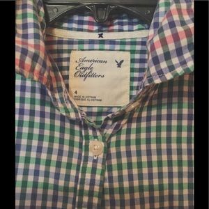 Plaid button down shirt.