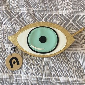 Nila Anthony gold eyeball clutch handbag