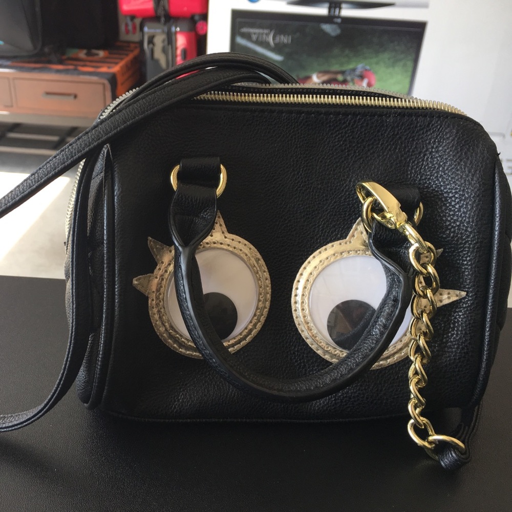 Small googlie eyes black cross body