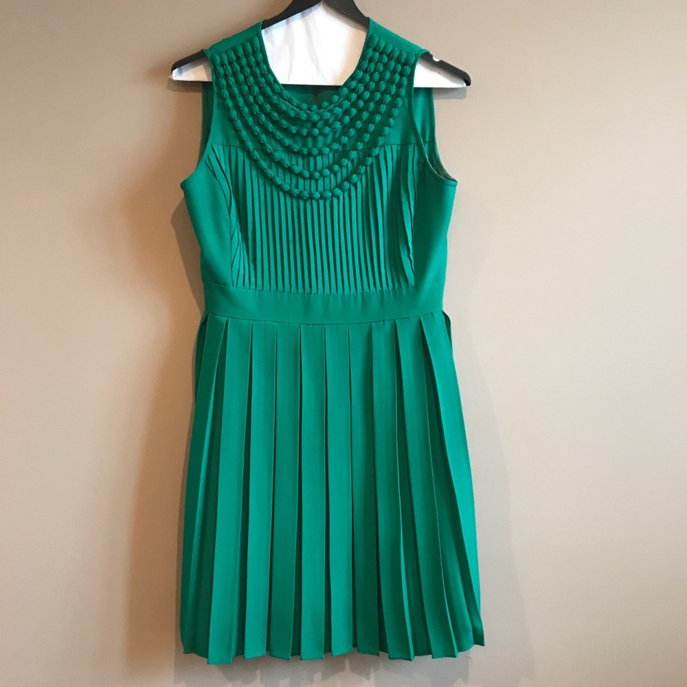 Emerald green dress with pleating