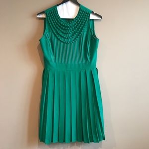 Emerald green dress with pleating