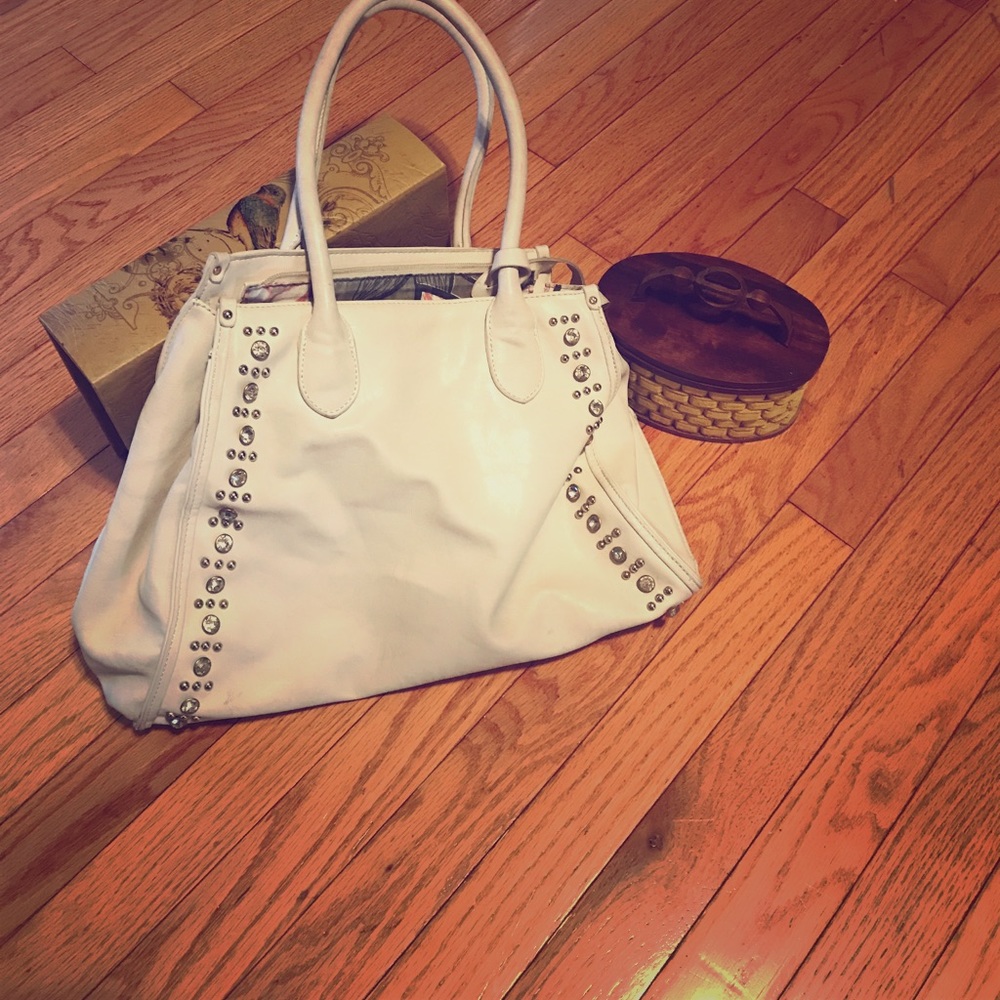 Cream purse with embellishments