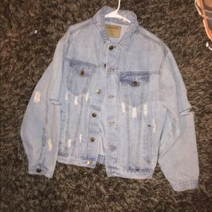 Men's distressed light wash denim jacket.