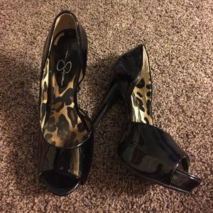 Black cut out peep toe heels.