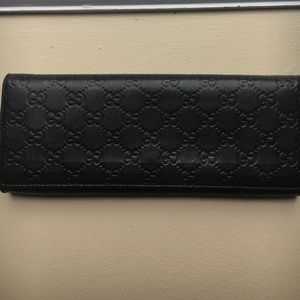 Black leather Gucci Clutch
