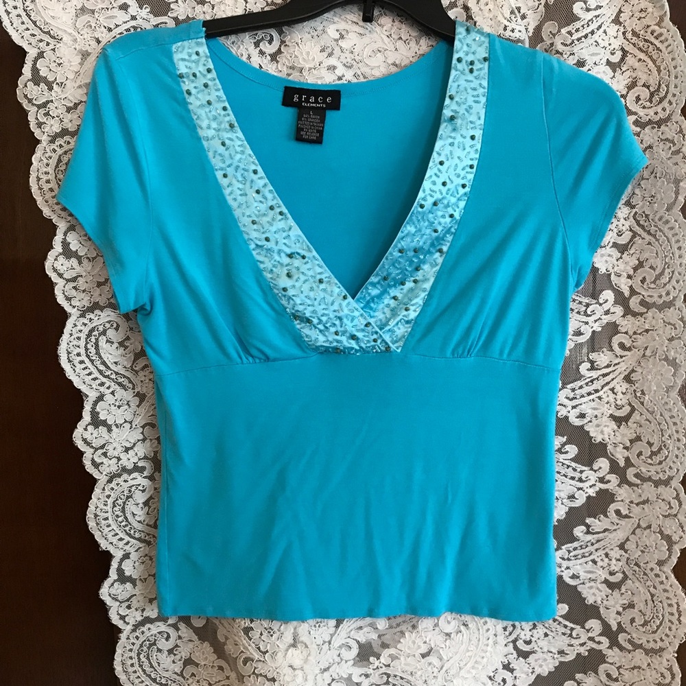 Turquoise low "V" neck dressy top