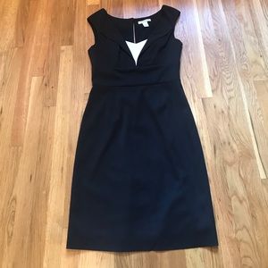 Little black dress with a white bodice accent.