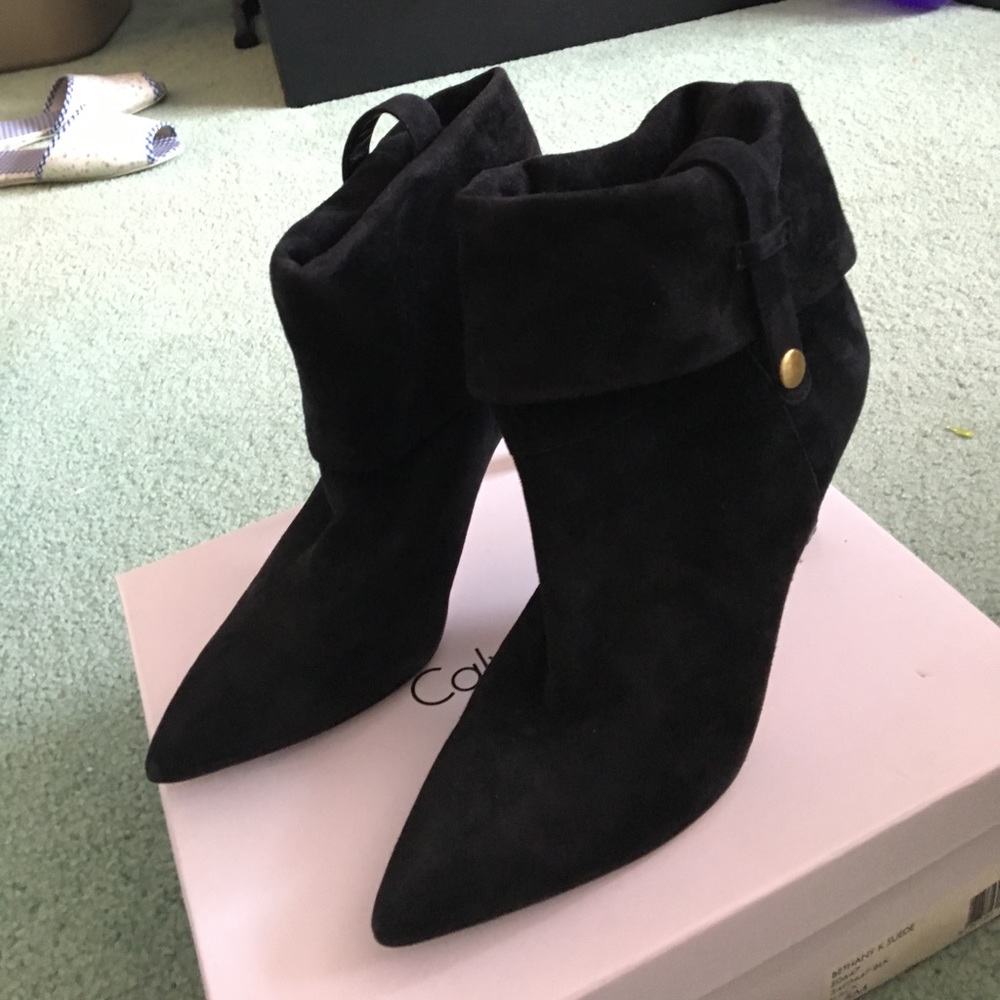 Calvin Klein black suede booties with 3 styles.