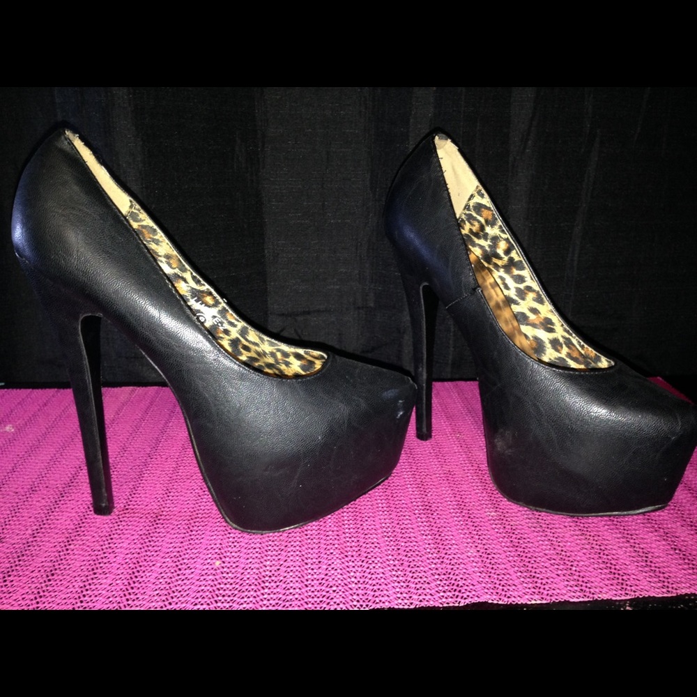 Black leather pumps