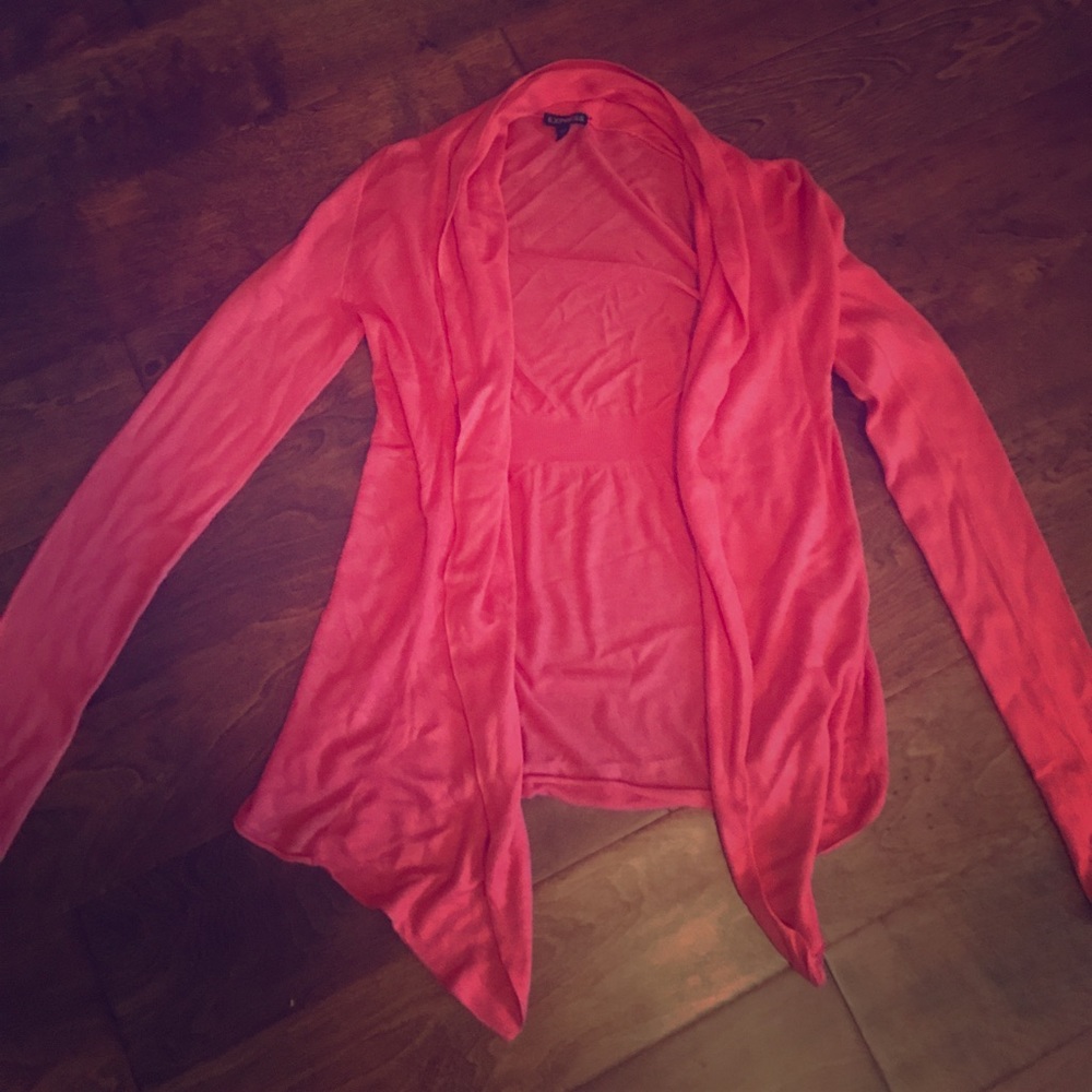 A coral colored sweater