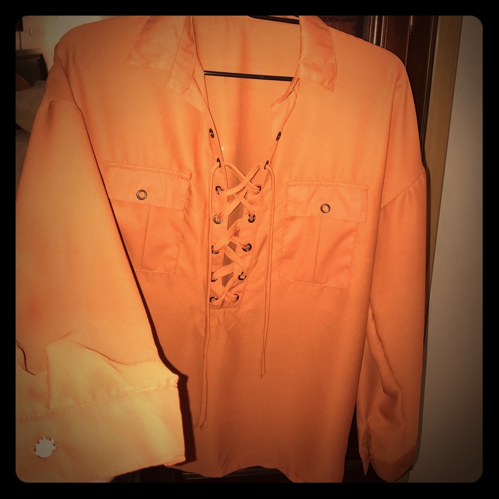 Beautiful rust colored lace up blouse