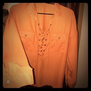 Beautiful rust colored lace up blouse