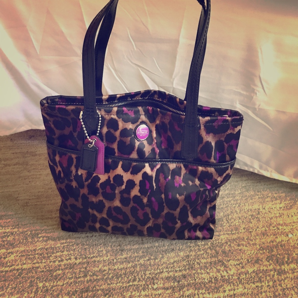 Coach purse cheetah with purple.