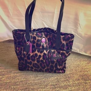 Coach purse cheetah with purple.