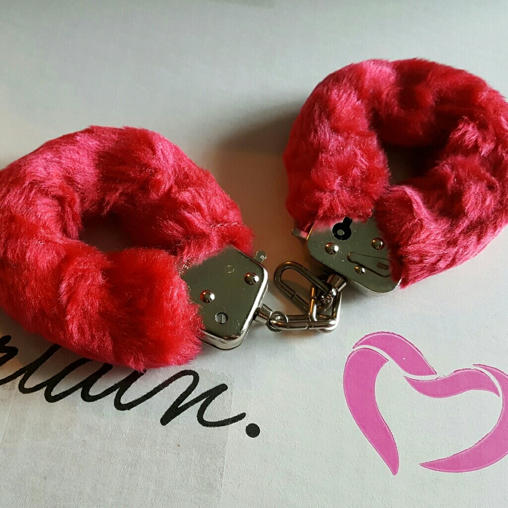 Pure Romance hand cuffs.