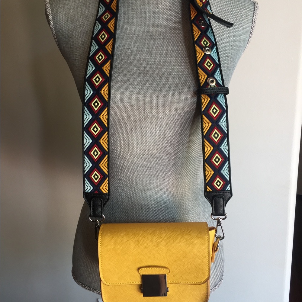 Small yellow purse w guitar strap,
