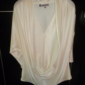Cream shimmery blouse.
