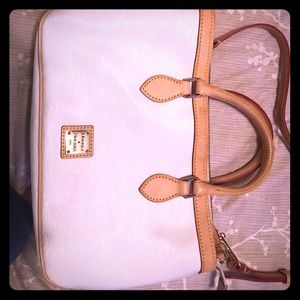White and tan Dooney & Burke small handbag.