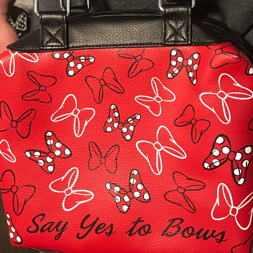 Purse.  Disney say yes to bows