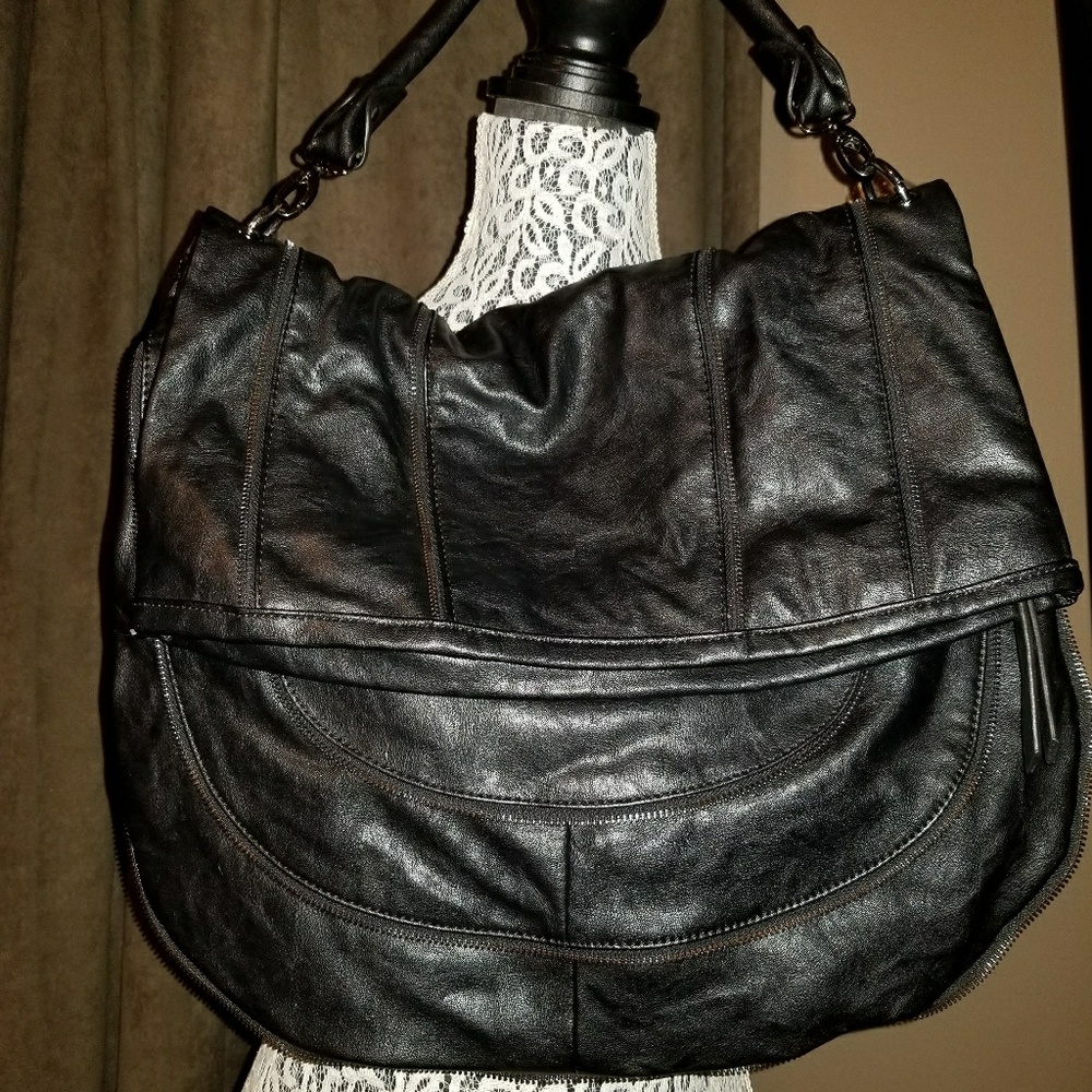 Black bag with zipper embellishments. Cool bag