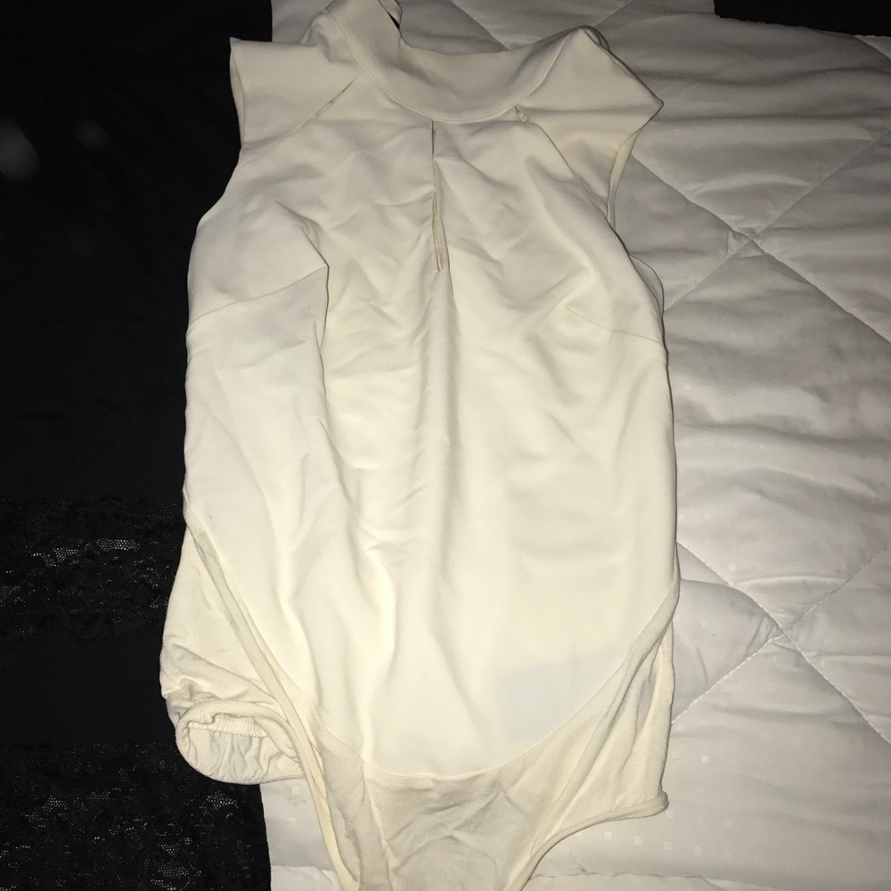 Cream colored Bebe high neck bodysuit