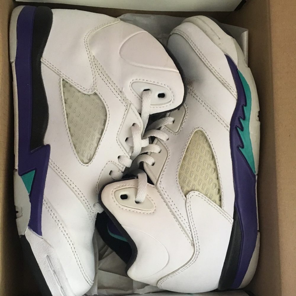 pair of white-purple-teal Air Jordan 5's in box