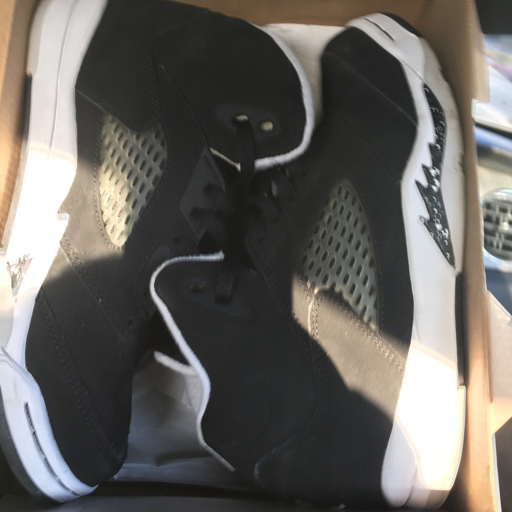 Pair of white-gray-and-black Air Jordan 5 in box