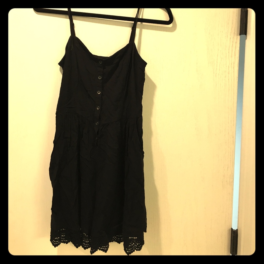 Black romper with lace hem