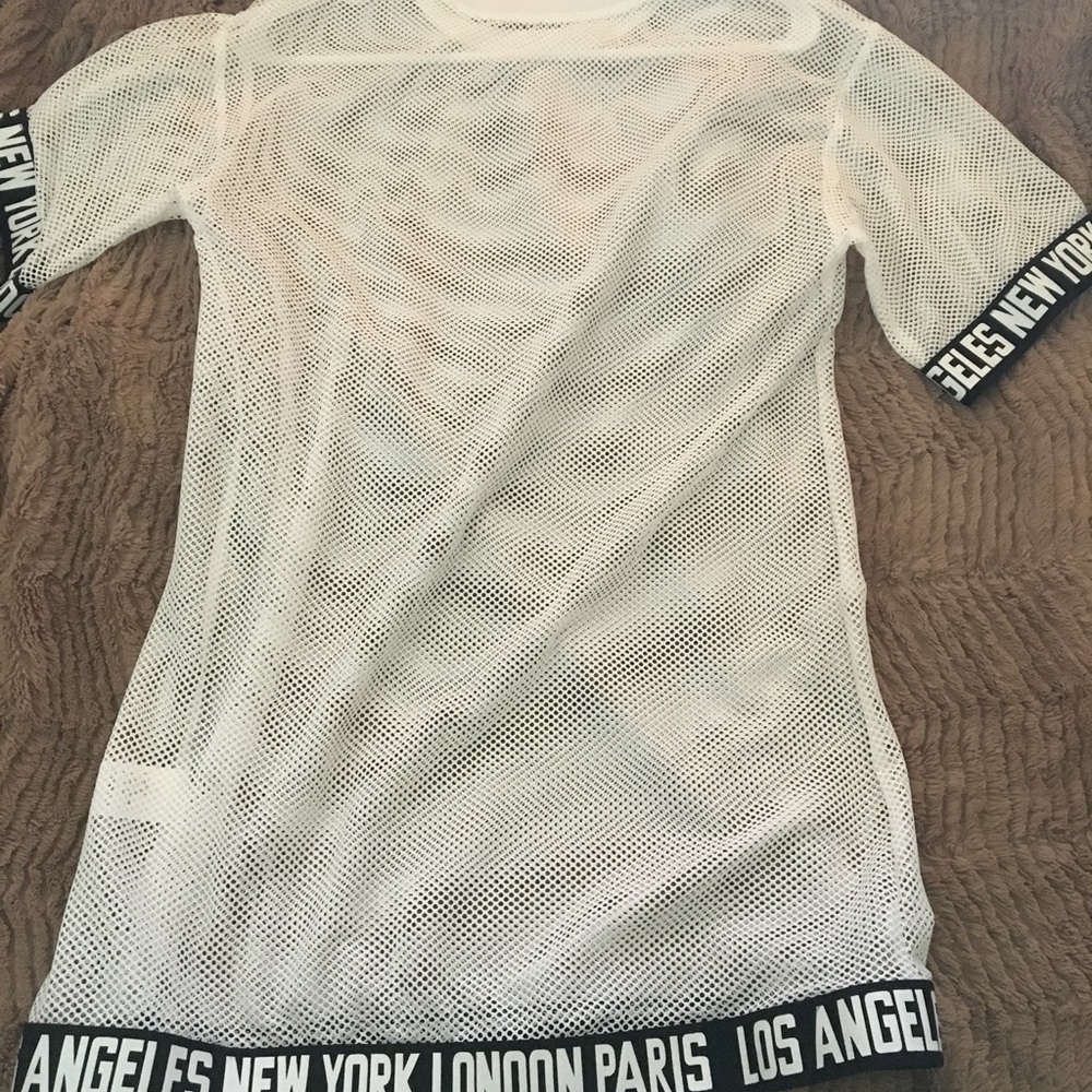 I'm selling a mesh white long blouse
