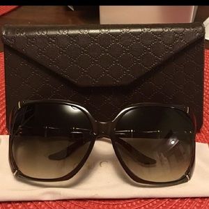 Women's authentic bamboo Gucci Sunglasses.