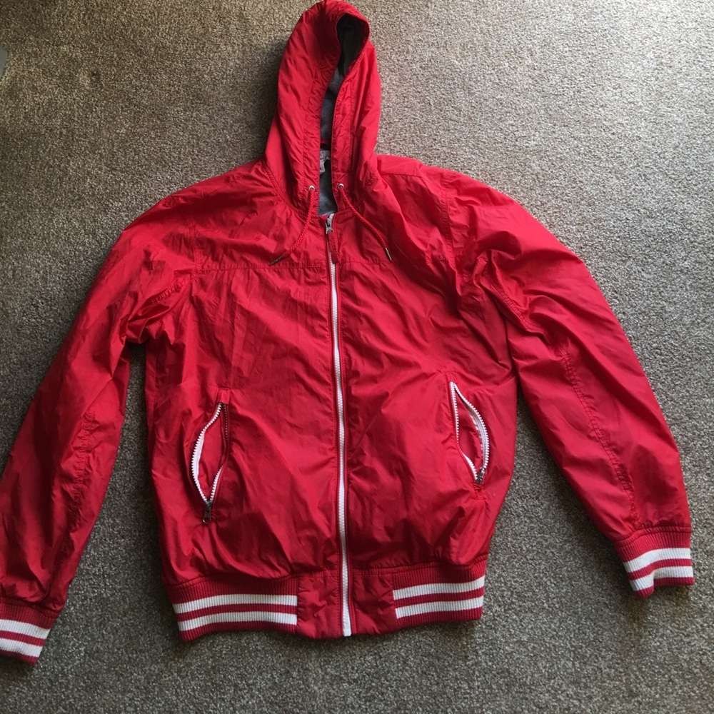 Red and white H&M zip-up jacket.