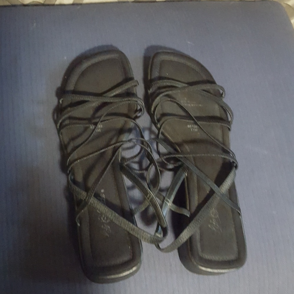 Strappy black sandals.