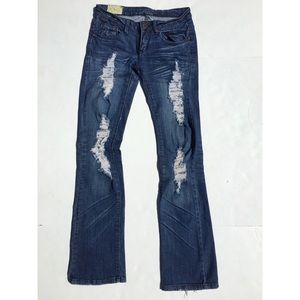 Machine distressed denim jeans