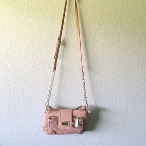 Pink leather shoulder bag by Charming Charlie.