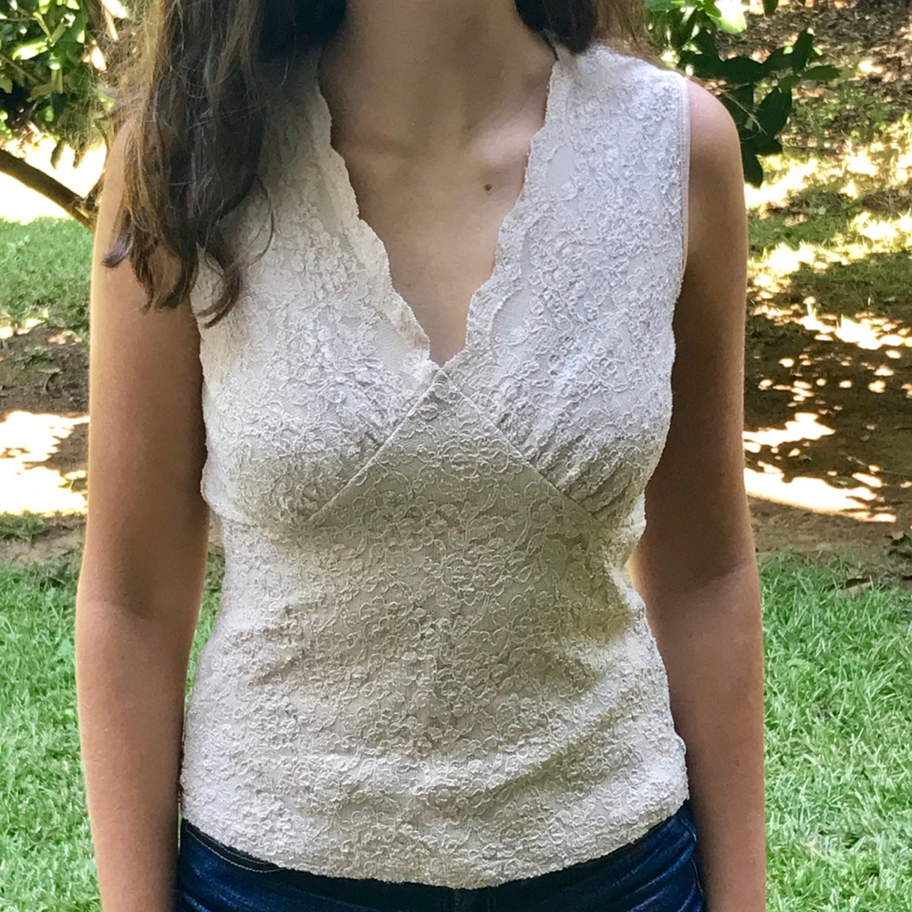 Neutral lace-covered suit blouse