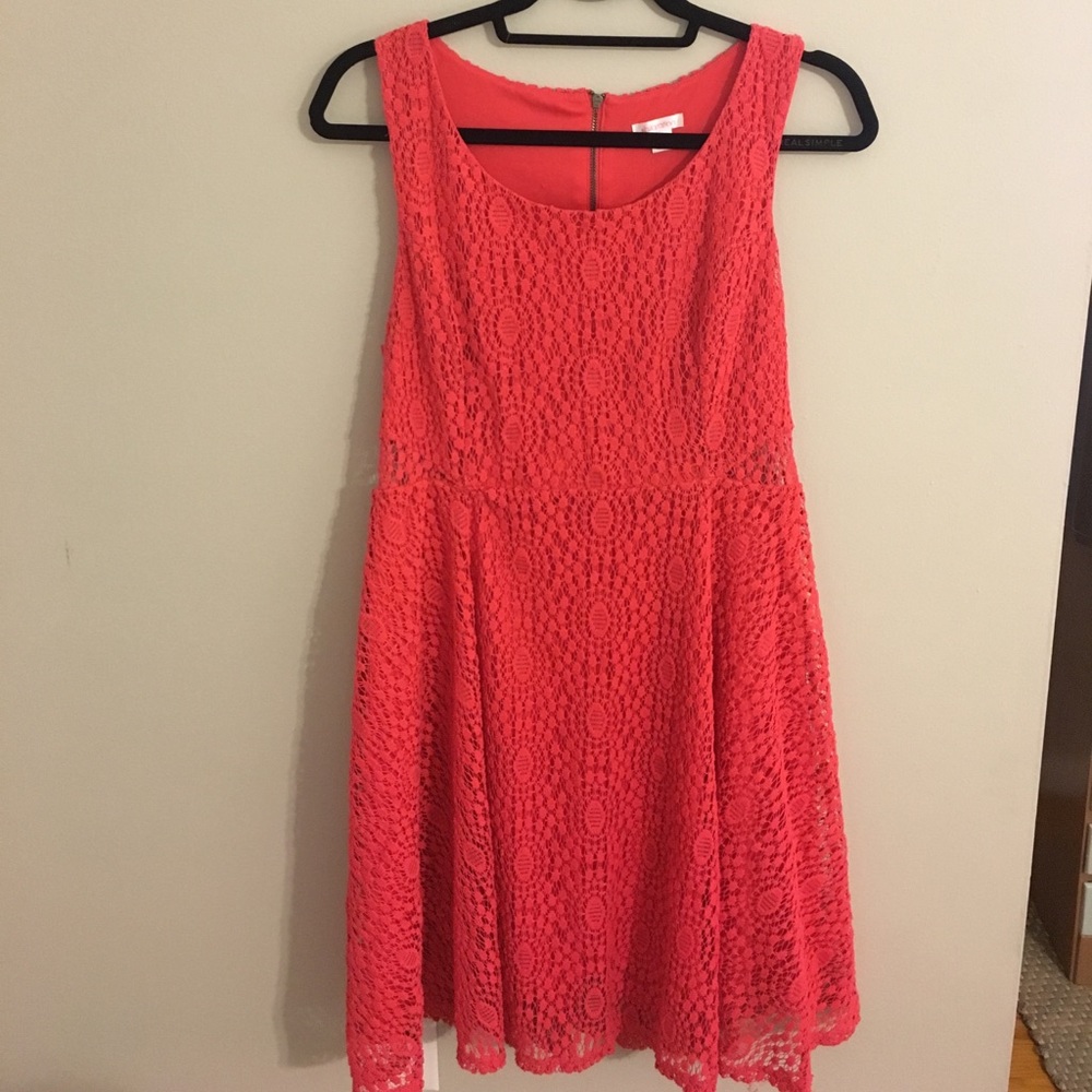 Coral lace dress with subtle cut-out sides