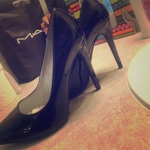 Black pointed toe pumps